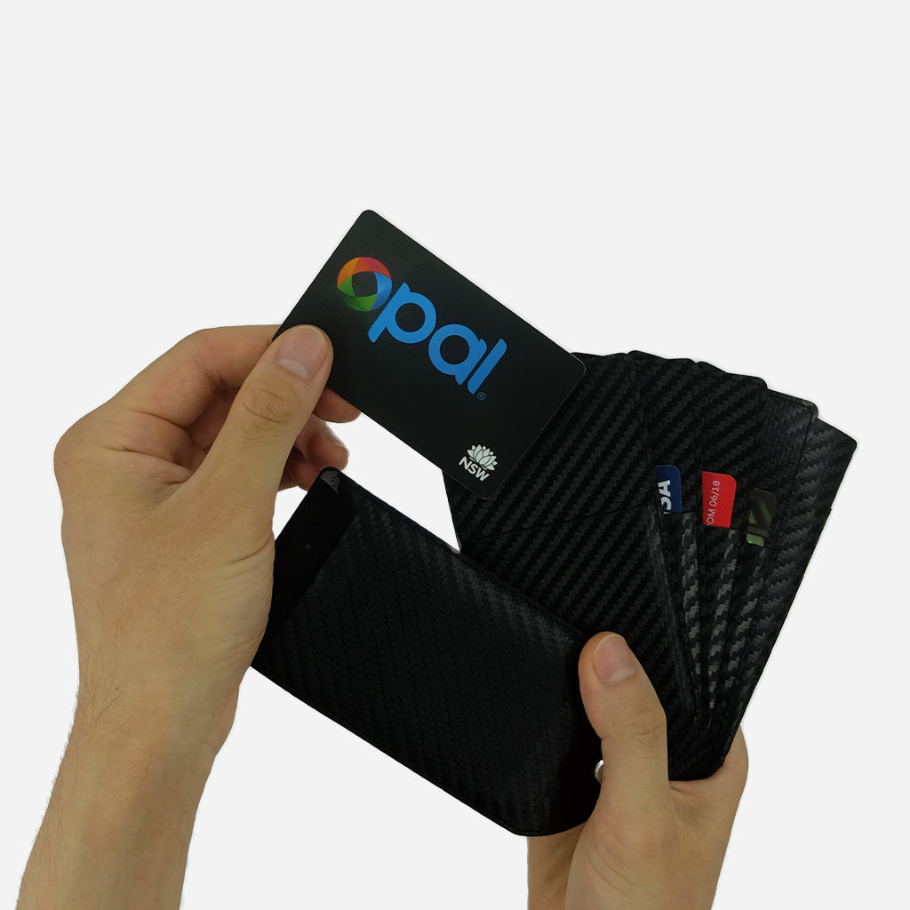 Taking out an Opal Card from the Fanning Wallet